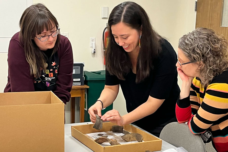 People looking at artifacts. 